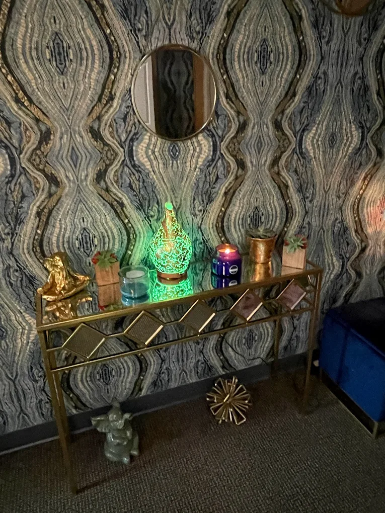 Gold console with diffuser and crystal accents