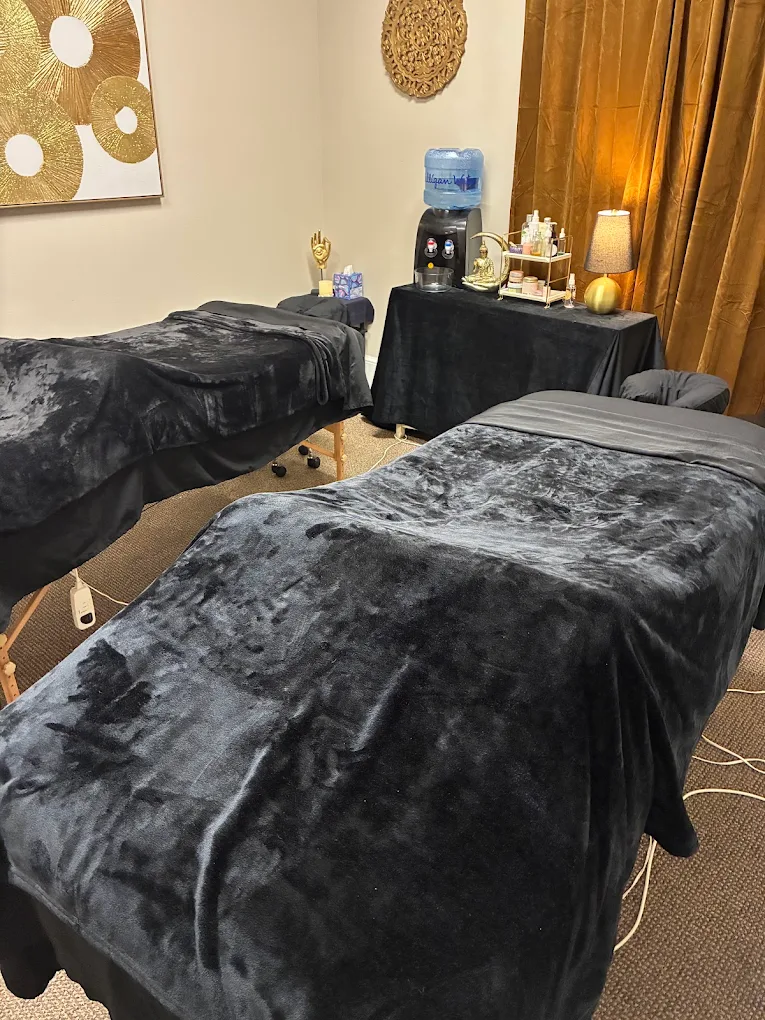 Couples massage suite with black velvet linens