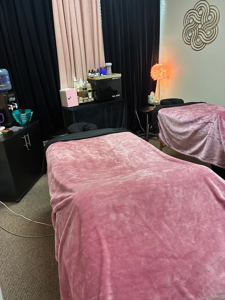Couples massage suite with pink linens