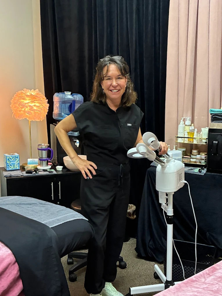Om aesthetician performing a custom facial