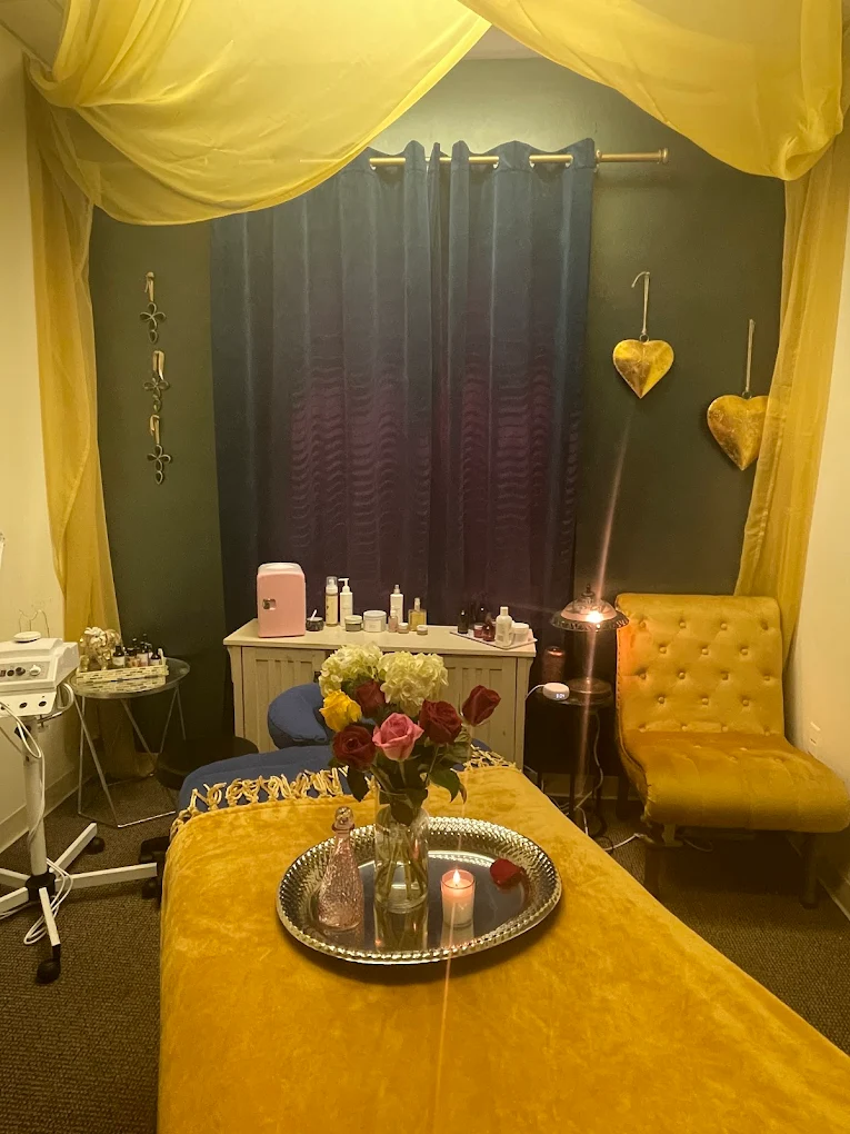 Facial room with fresh roses and golden canopy