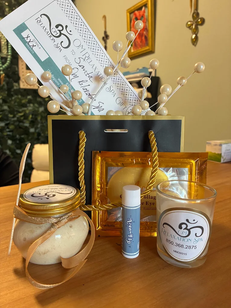 Om gift bag with collagen eye masks, candle and lip balm