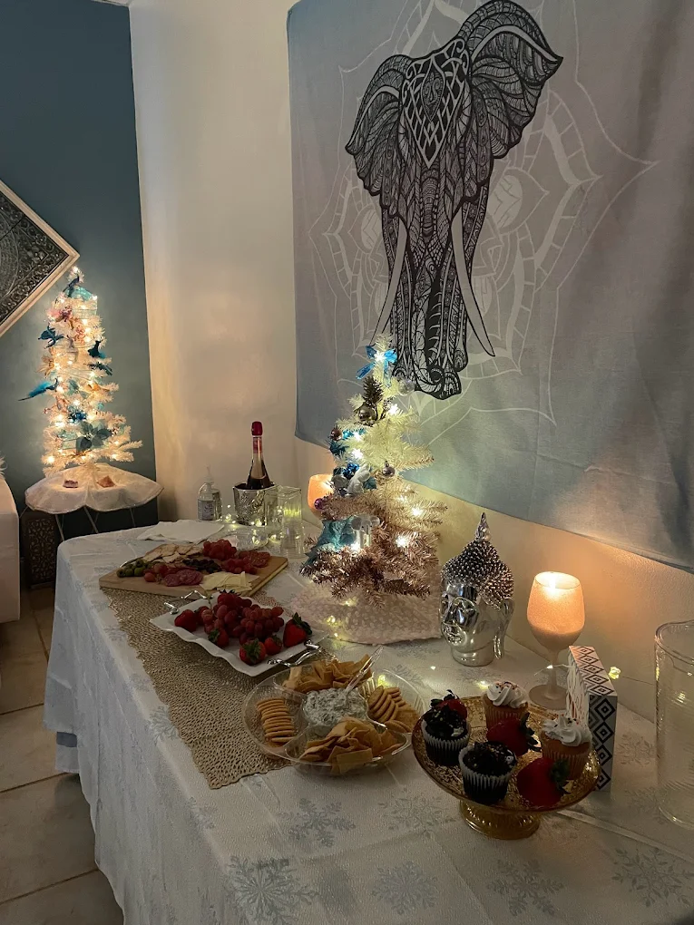 Holiday spa party table with champagne and desserts